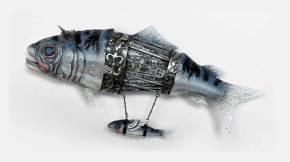 A mechanical fish assemblage sculpture with a tiny passenger