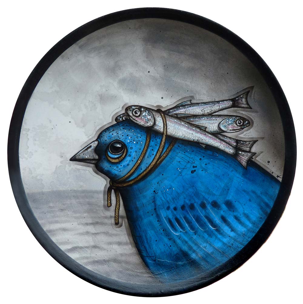 A blue bird with some tied-on fish friends looks out at a stormy sea