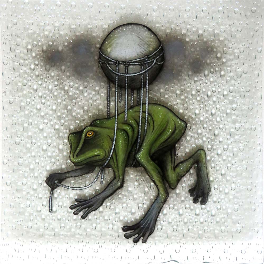 A frog floating under a weather balloon in the rain